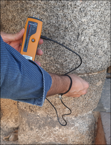 Humidity measurement using a protimeter in the columns of the access gate to the Palace of King Don Pedro, current School of Translators in Toledo, Spain 